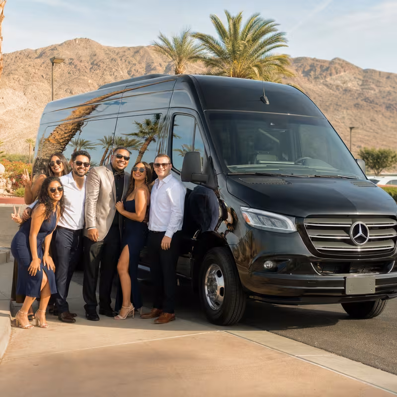 Group beside a Mercedes Sprinter limo from the Las Vegas fleet