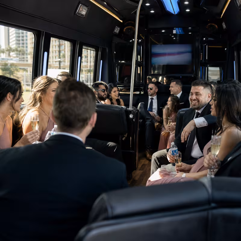 Wedding guests seated inside a Las Vegas party bus
