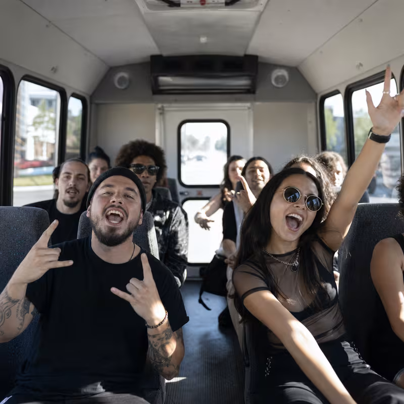 Party bus interior with wraparound leather seating and LED lighting in Las Vegas