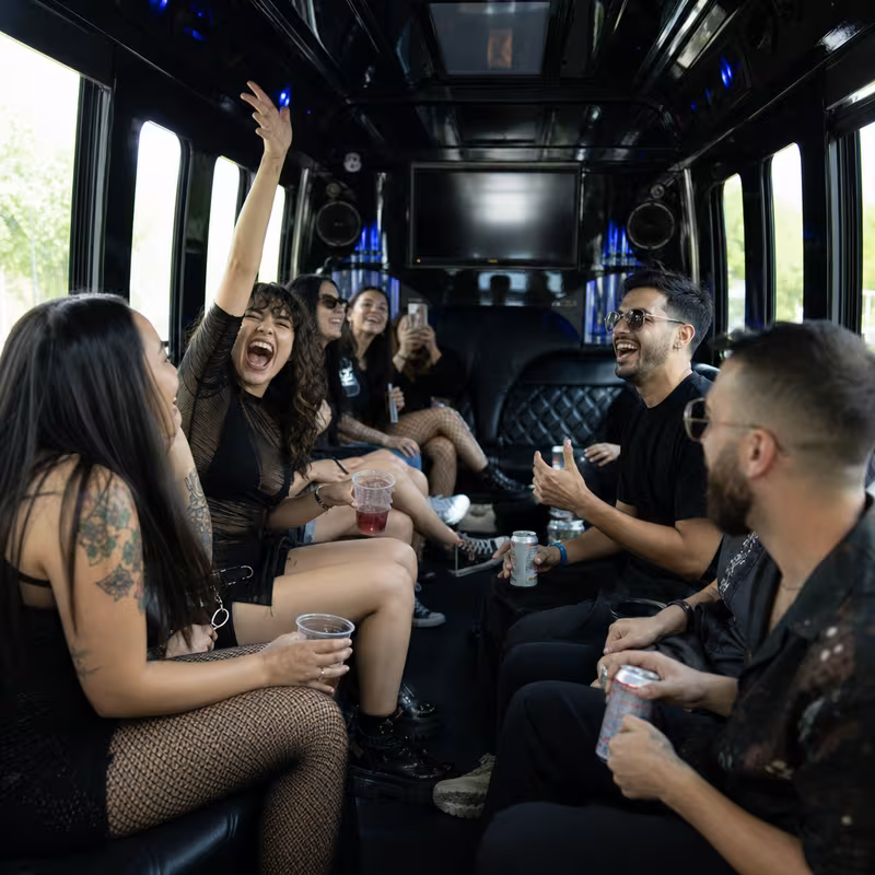 Passengers loading luggage while boarding an Las Vegas group shuttle