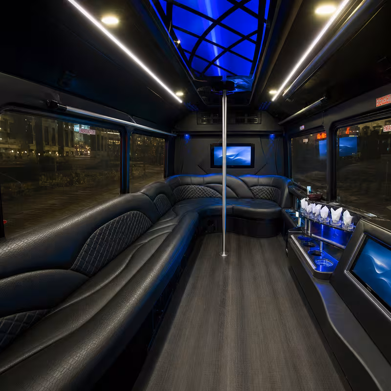 Party bus interior with wraparound leather seating and LED lighting in Las Vegas