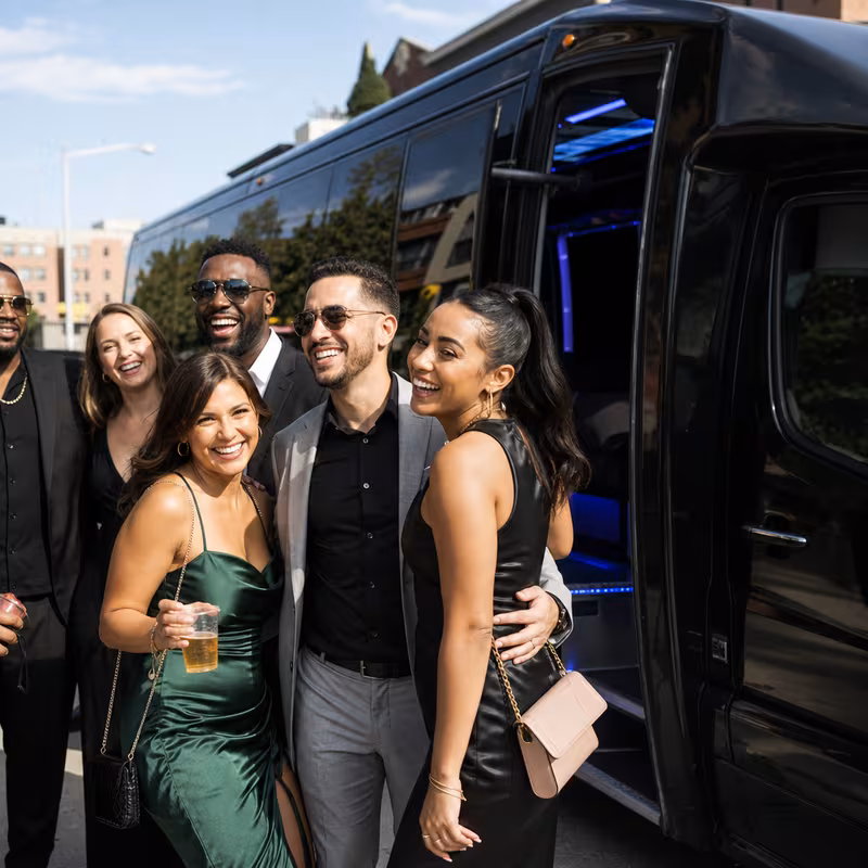 Passengers loading luggage while boarding an Las Vegas group shuttle