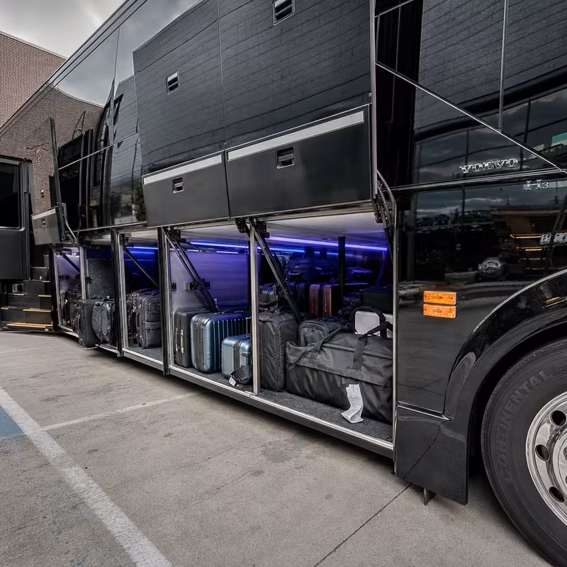 Party bus interior with wraparound leather seating and LED lighting in Las Vegas