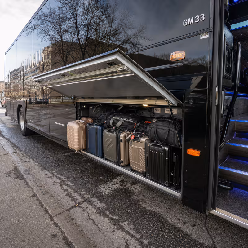 Party bus interior with wraparound leather seating and LED lighting in Las Vegas