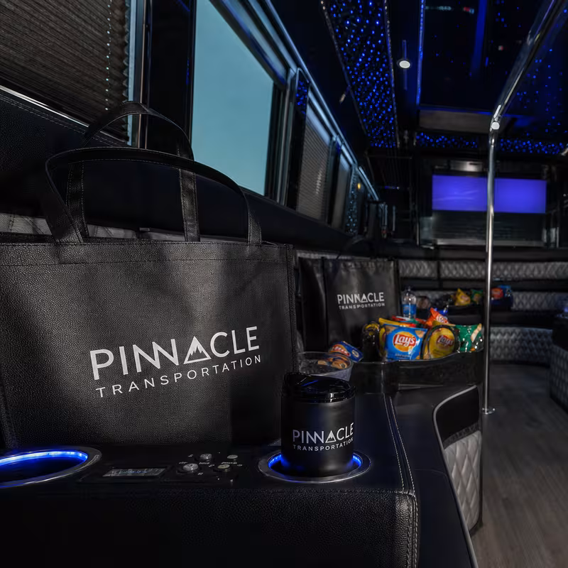 Party bus interior with wraparound leather seating and LED lighting in Las Vegas